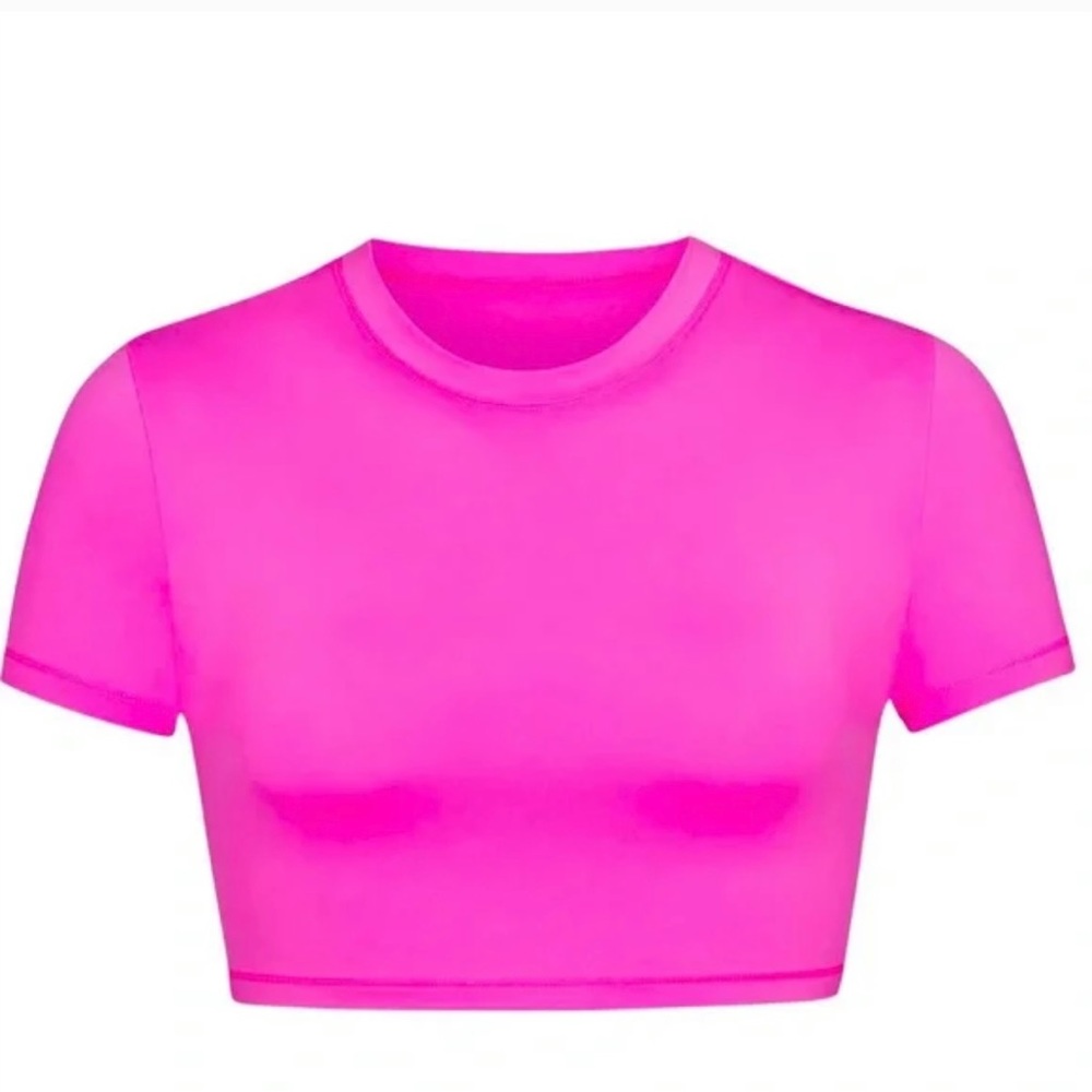 Skims size medium swim t-shirt in taffy. New with tags